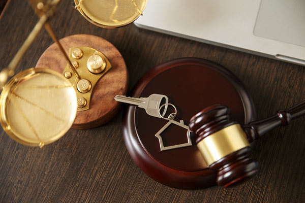 gavel and keys on wooden table symbolizing legal decisions and property ownership